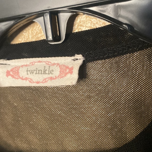 Very sheer top with beautiful floral appliqué. Choker style neckline. Size M. - Picture 3 of 3